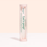 A cylindrical Lets prep! case holds the Manucurist-us Glass nail accessory trio, including a glass cuticle pusher and nail file, shown on a light beige background.