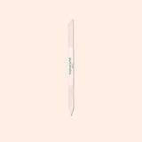 The Manucurist Glass Cuticle Pusher features a pointed tip and beveled edge for precise nail contouring, with "manucurist" in green on a white center section, displayed on a light beige background.