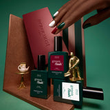 Three horizontal sections display close-ups of Manucurist Green Flash gel polishes from the Customizable Trio: a deep red shade labeled Amour, a dark green labeled Emerald, and a shimmery white labeled Bliss. Each section showcases a streak of glossy Green Flash gel polish, highlighting vibrant color payoff and shine—all easily removed with your favorite nail polish remover.