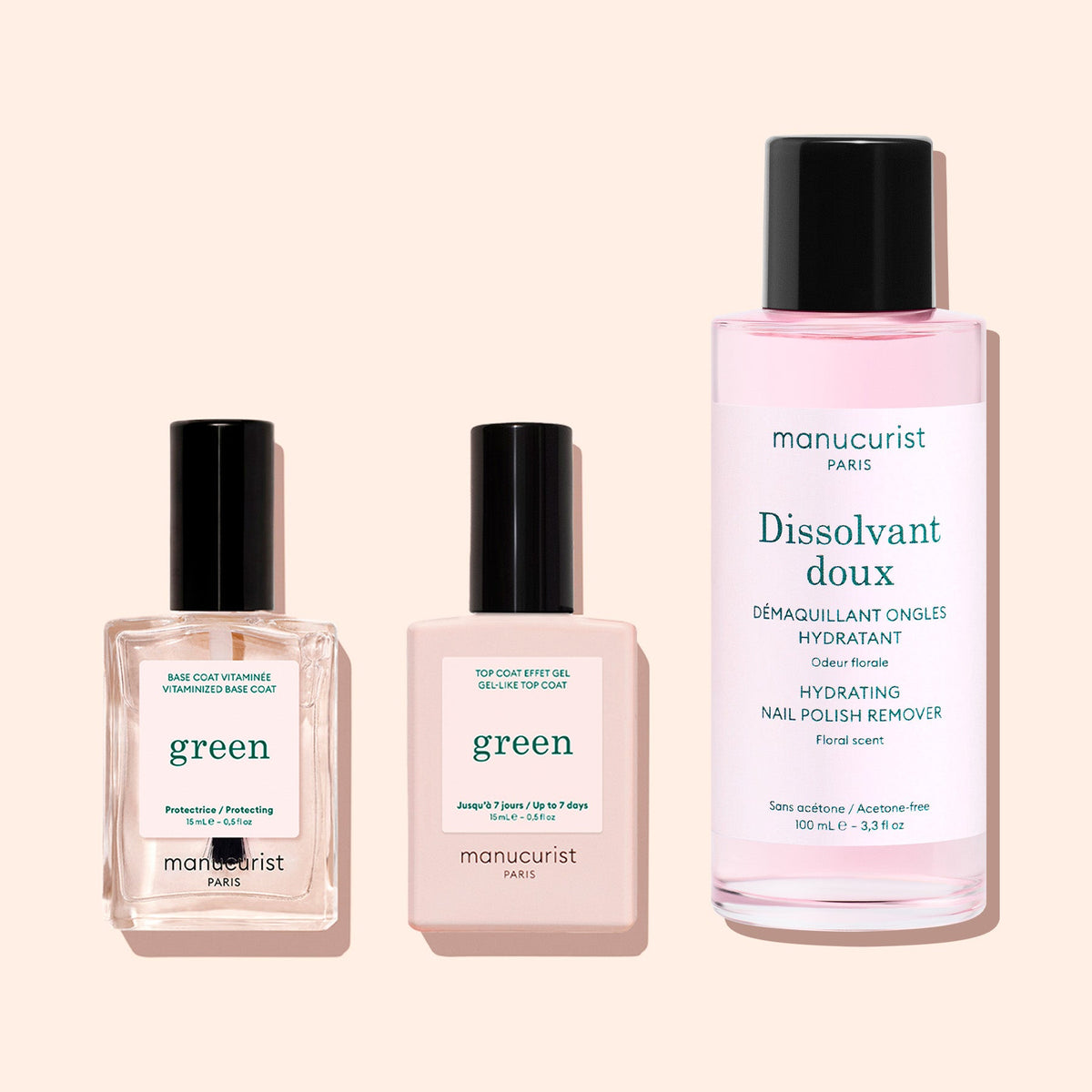 A pink bottle from the Manucurist Green™ Base, Top Coat  Nail Polish Remover Trio with a black cap is displayed against a light background. Perfect for removing Green nail polish or refreshing your gel-effect manicure, its label displays details in both French and English.