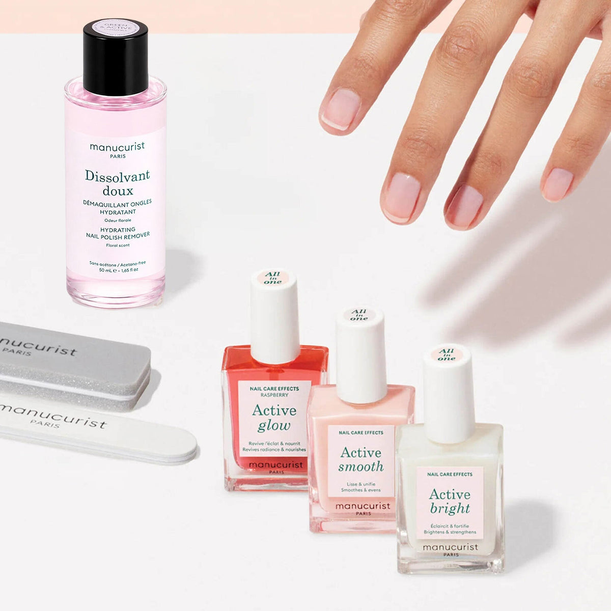 The Manucurist Active Manicure Kit features two nail files, three bottles of nail treatment polish, and a bottle of nail polish remover—each item neatly arranged on a light beige background, making it the perfect addition to any manicure kit.
