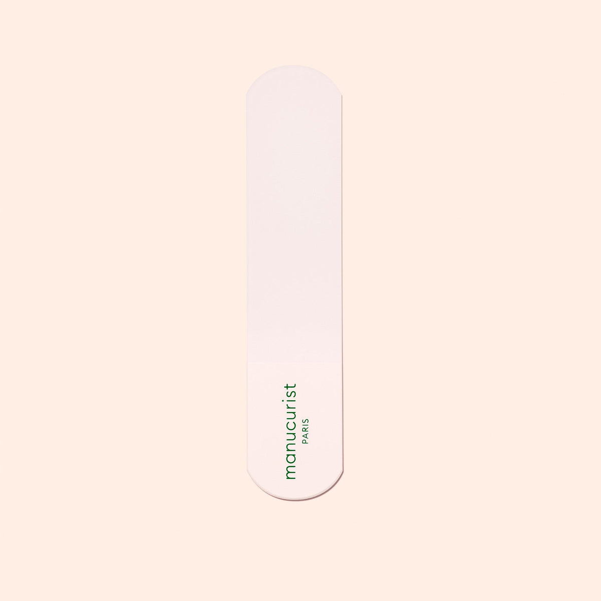 A single pink nail file with rounded ends and the green Manucurist-us logo, ideal for pairing with the Manucurist-us Glass Foot File to exfoliate heels and achieve soft, smooth skin.