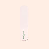 A single pink nail file with rounded ends and the green Manucurist-us logo, ideal for pairing with the Manucurist-us Glass Foot File to exfoliate heels and achieve soft, smooth skin.