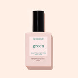 A bottle of Manucurist Green Sunshine Top Coat comes in a pale pink rectangular bottle with a black cap and white label, offering a gel-effect finish with its plant-based formula.
